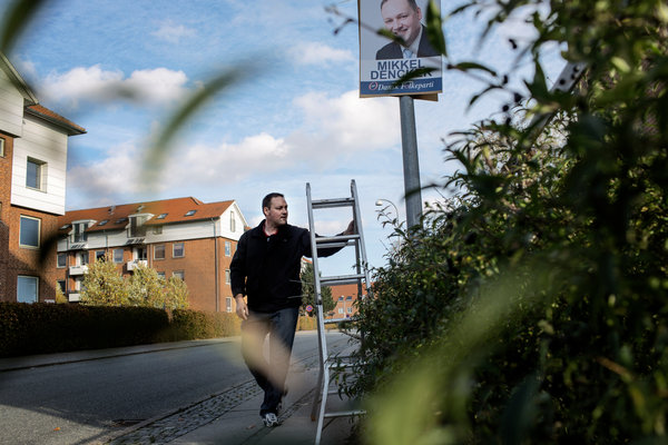 Mikkel Dencker, a mayoral candidate in Hvidovre, Denmark, put up campaign posters. He has made the removal of meatballs from kindergarten in deference to Islam a campaign issue.